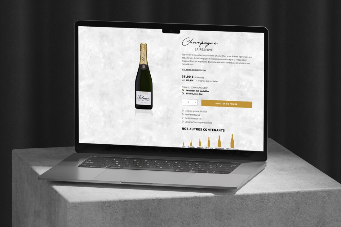 Une fiche produit du site Palmer & Co sur un ordinateur portable : la bouteille, son descriptif et son prix.